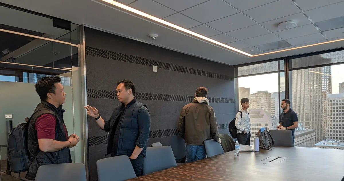 members talking in small groups after a speaker event