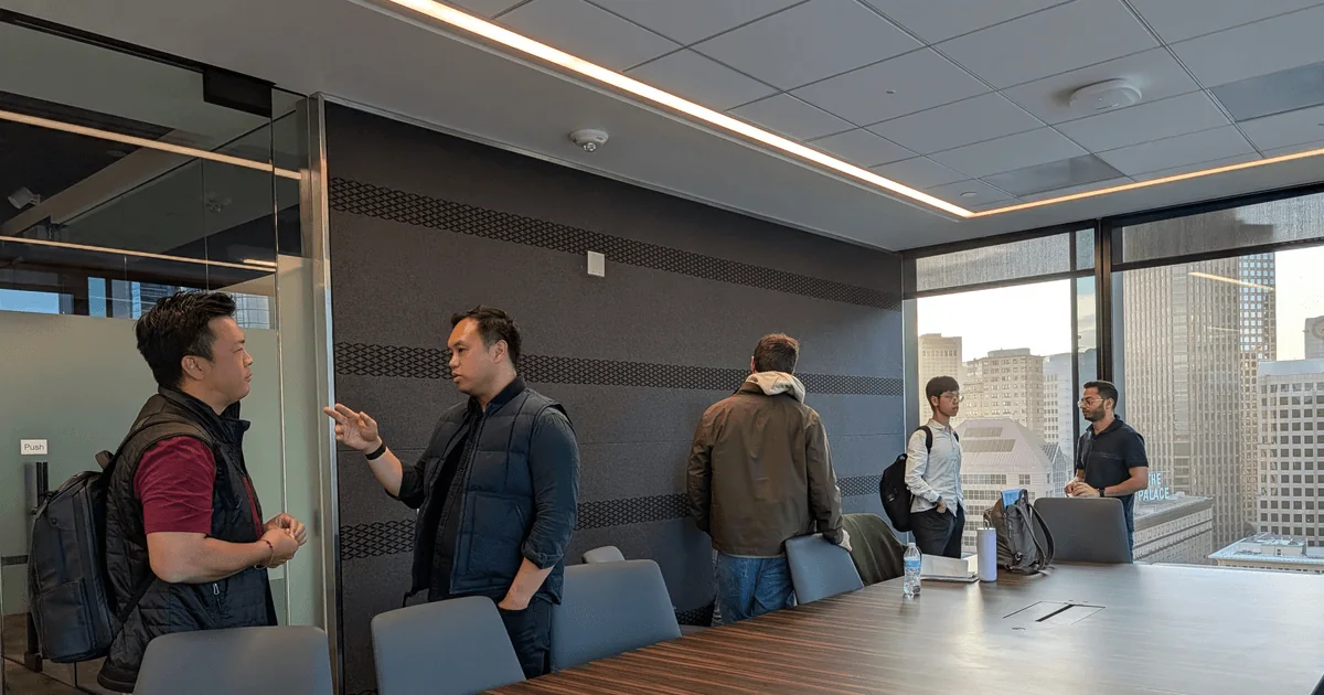 members talking in small groups after a speaker event