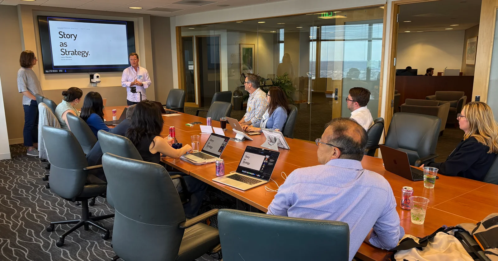 participants gathered around a conference table for a Story as Strategy session