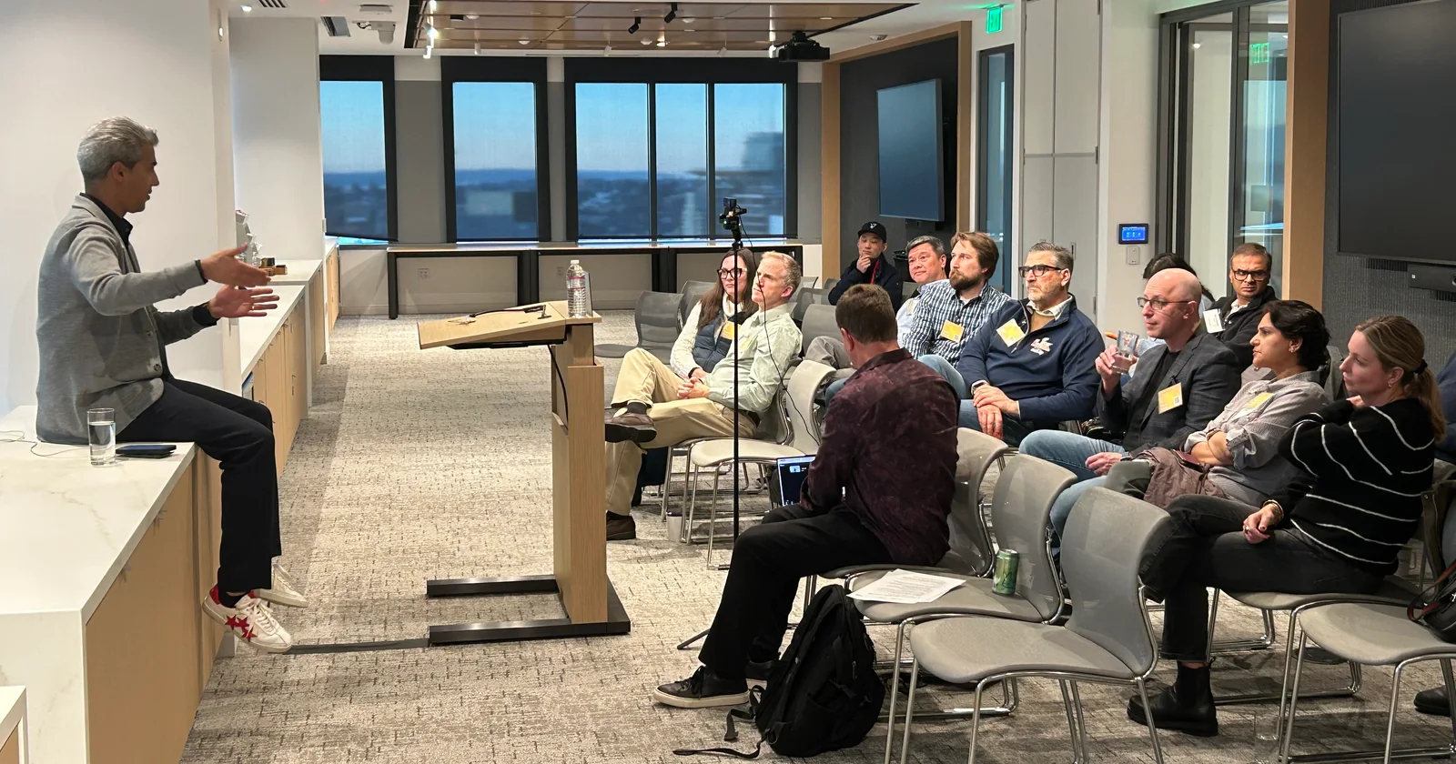 A speaker talking with participants during an in-person session